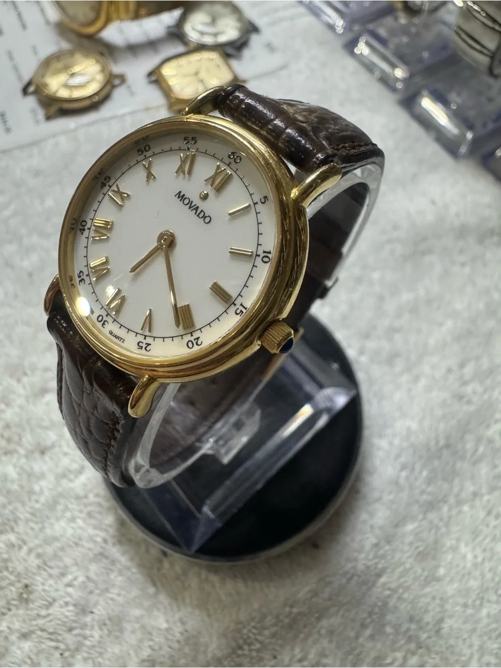 #120 Movado Gold Tone Case White Dial Watch with Brown Leather Strap